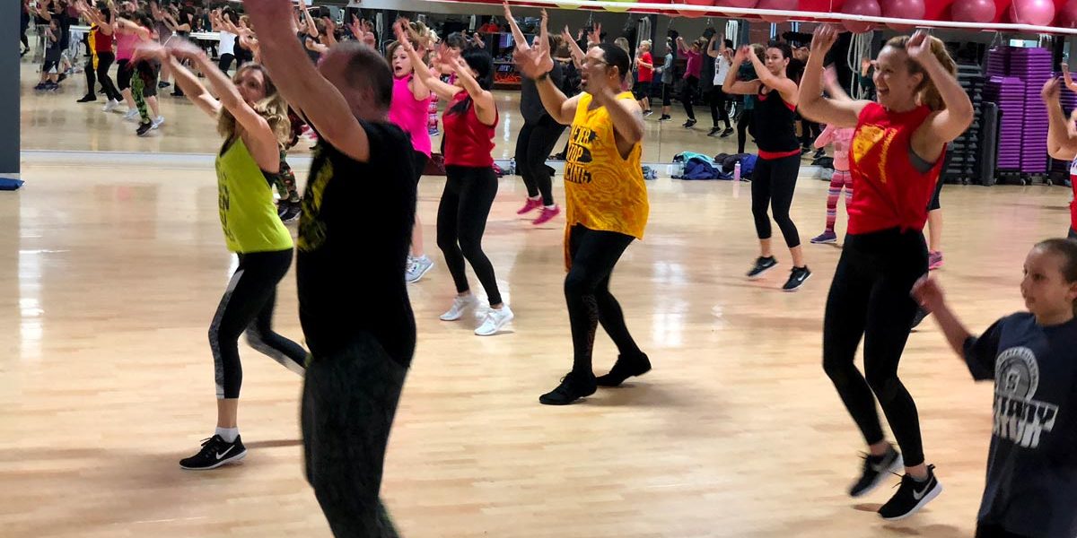 image of Zumba class at Four Seasons Fitness helping to support SPARC