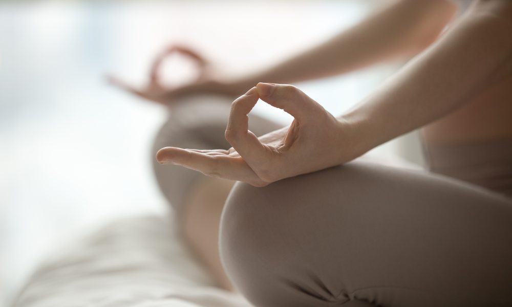 image of a woman practicing Yoga